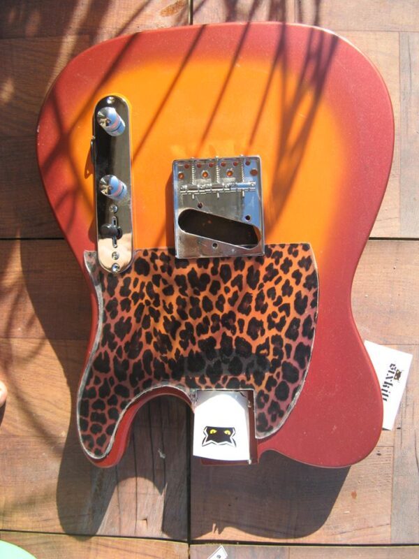 leopard pickguard on a red-burst