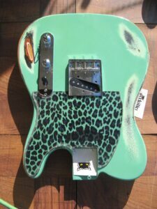 leopard pickguard on surf green guitar