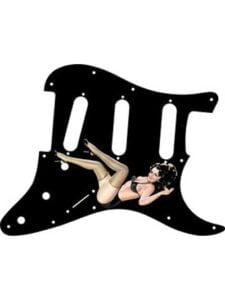 Brunette pinup girl Julia in black lingerie with thigh-high stockings on a Stratocaster pickguard
