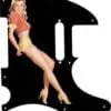 Blonde pinup girl wearing orange-red blouse with yellow panties and heals on a balck Telecaster pickguard