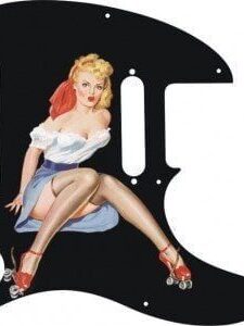 Strawberry blonde pinup girl Audrey in white strapless blouse with blue skirt and roller skates