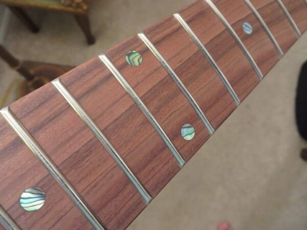 Roasted Curly Maple Stratocaster Neck close-up of frets