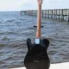 black back of complete blue flame maple topped tele guitar