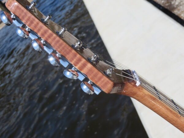 headstock close-up of flame maple neck details