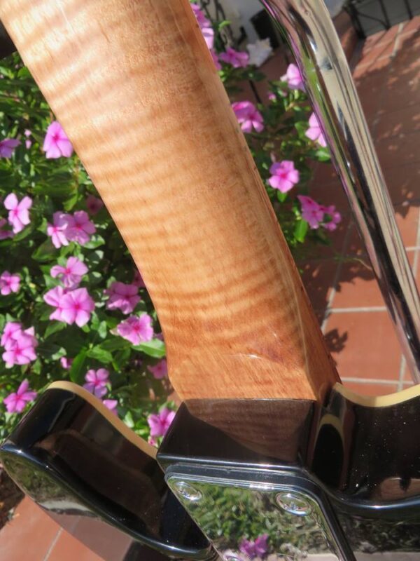 close up of flame maple neck on blue flame maple topped tele